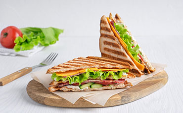Create a clipping path for a food item like a sandwich on a rustic wooden table