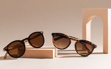 Create a clipping path for a product image pair of sunglasses on a colored background